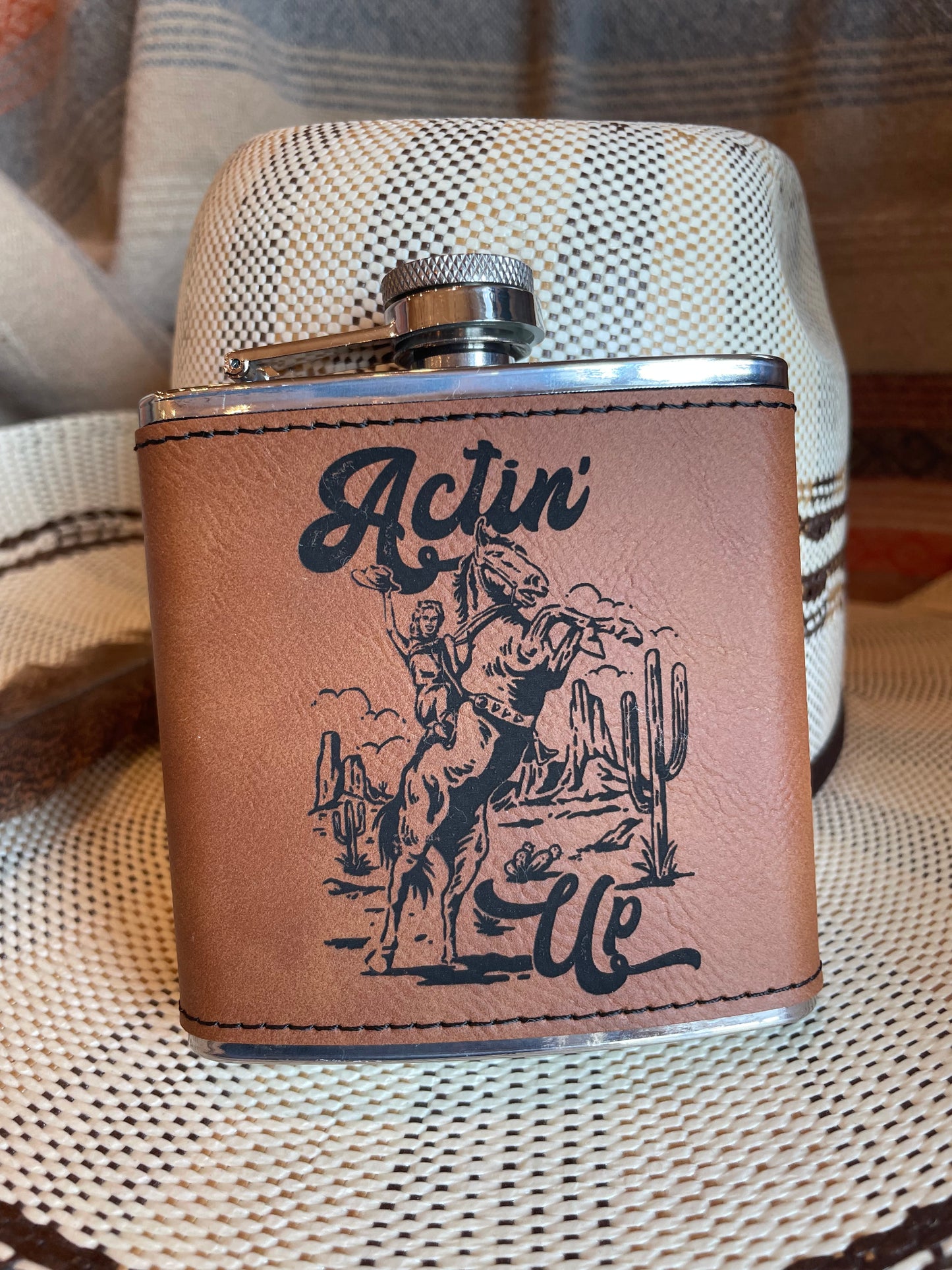 Rawhide 6 oz. Western leatherette stainless steel flask - "Actin' Up"